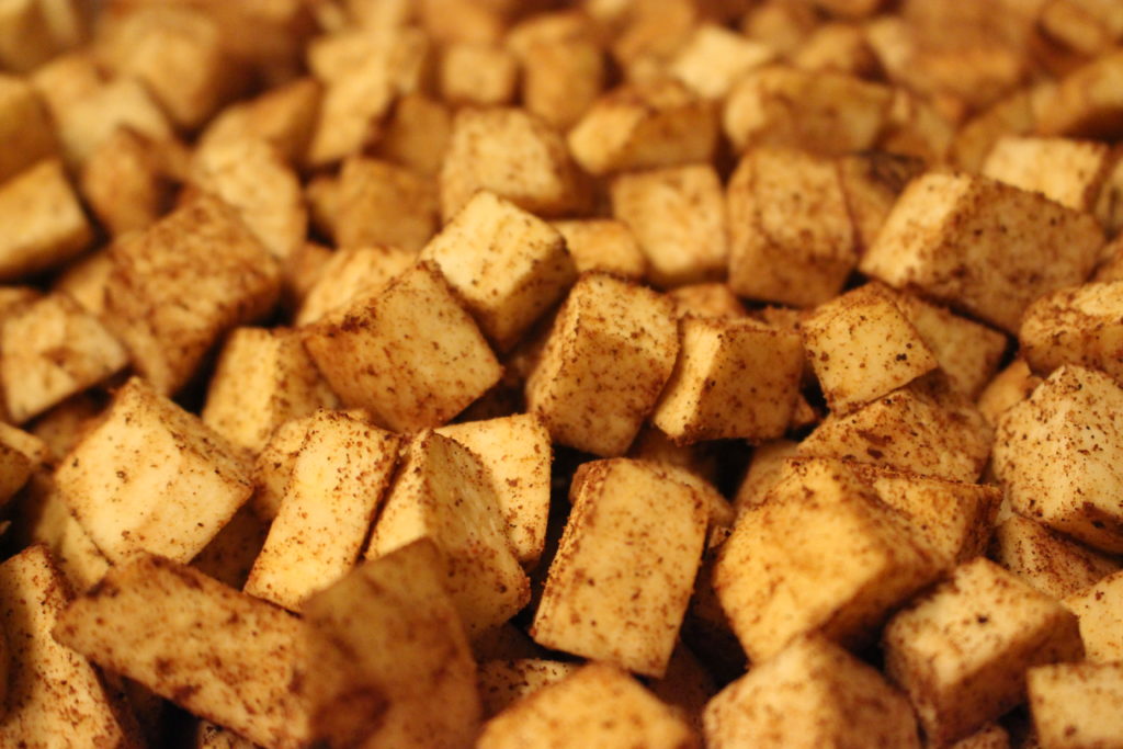 Spiced sweet potatoes ready for baking.