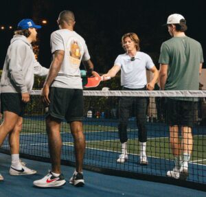 Group of friends enjoying a pickleball game on a Scottsdale night.