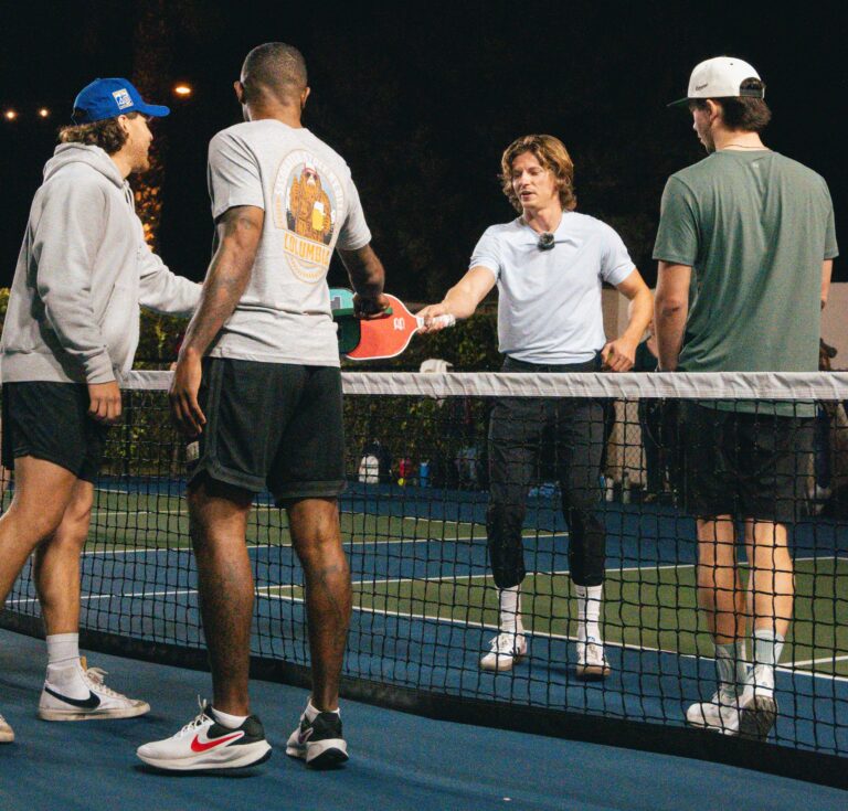 Group of friends enjoying a pickleball game on a Scottsdale night.