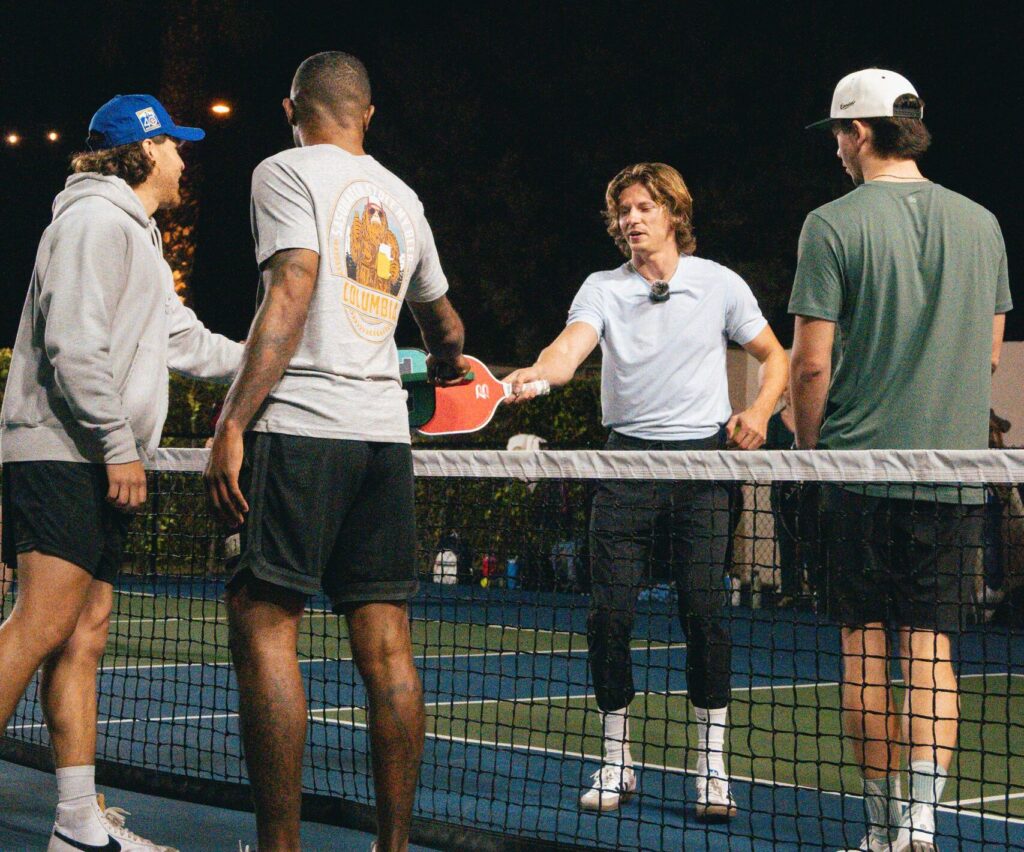 Group of friends enjoying a Pickleball game on a Scottsdale night.
